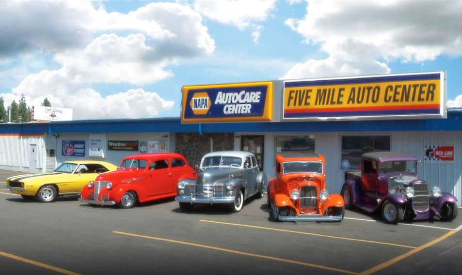 Classic cars parked outside Five Mile Auto Center in Spokane